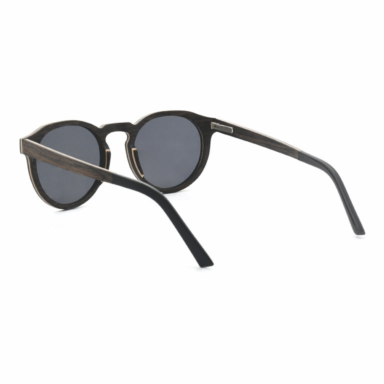 Conspek Sunglasses with grey lenses, wooden frame and acetate tip arms by Spek Eyewear.