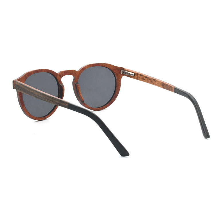 Conspek Sunglasses with grey lenses, wooden two-tone frame and acetate tip arms by Spek Eyewear.